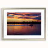 Textured art of abstract Mississippi scenery in muted earth tones on a framed silver mat, suitable for bedroom decor.