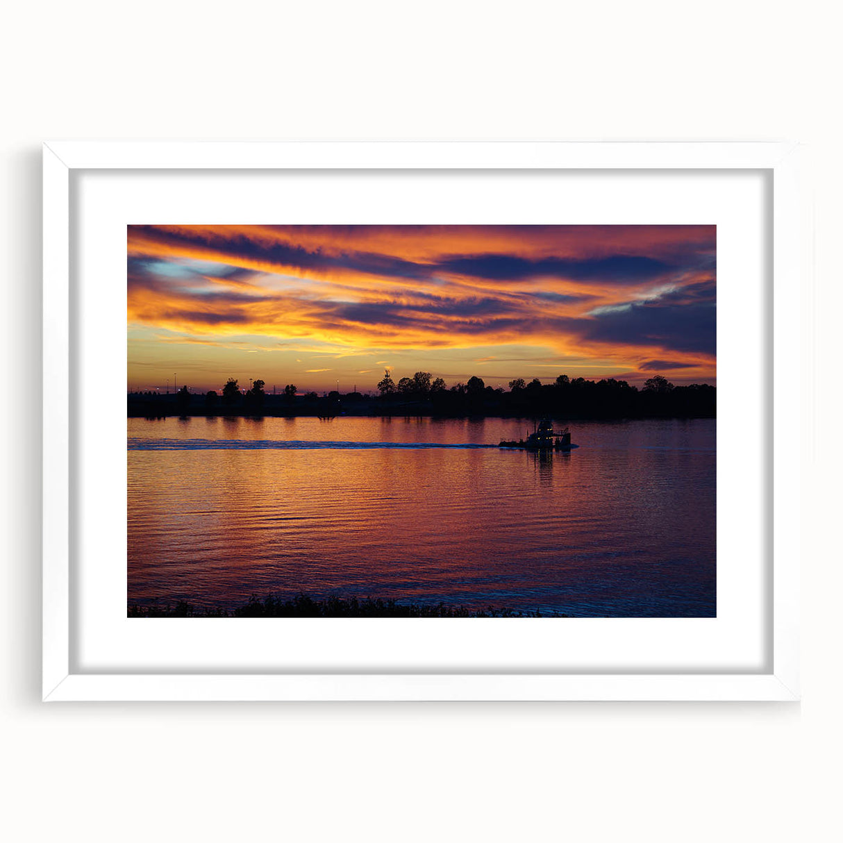 Abstract art print of the Mississippi landscape in muted earth tones on a framed white mat, suitable for dining room decor.