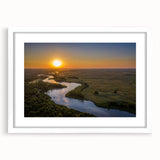 Abstract art print of Nebraska scenery in muted earth tones on a white-framed canvas, ideal for dining room decor.