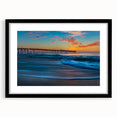 Colorful abstract art print of Cape Hatteras with textured design in vibrant hues on a large framed canvas.