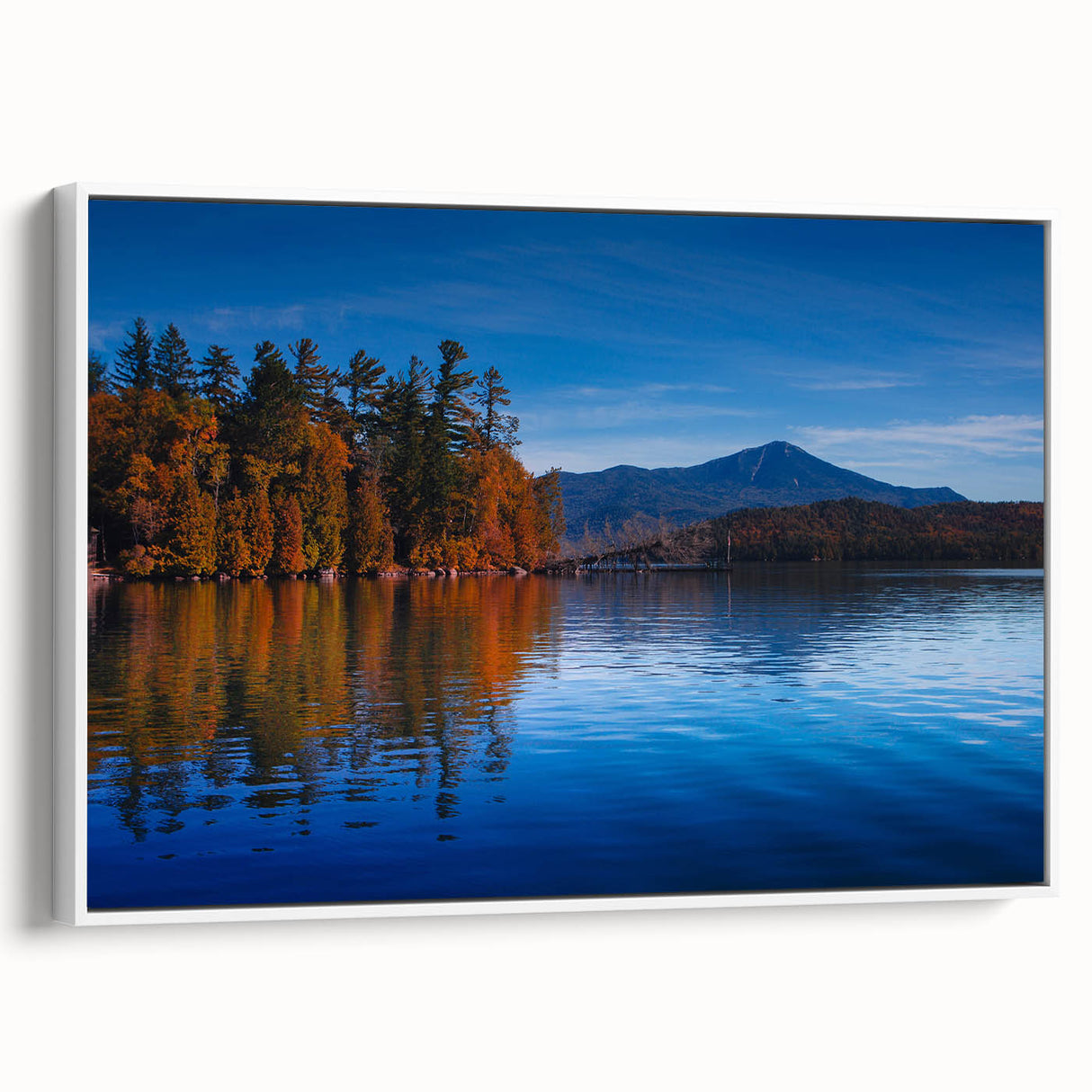 Vintage poster art of Adirondacks scenery on white-framed canvas, featuring vibrant colors, ideal for living room decor.