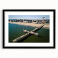 Colorful abstract art print of Coney Island in vibrant hues on a large textured canvas, ideal for living room decor.