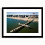 Colorful abstract art print of Coney Island in vibrant hues on a large textured canvas, ideal for living room decor.