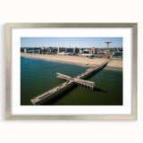 Textured abstract art print of Coney Island, featuring muted earth tones on a framed silver mat, suitable for bedroom art.