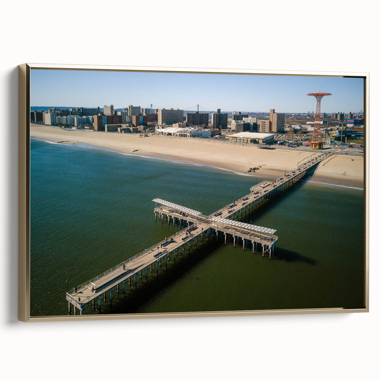 Framed canvas wall art featuring a vintage-style Coney Island landscape in black and gold tones, ideal for bedroom decor.