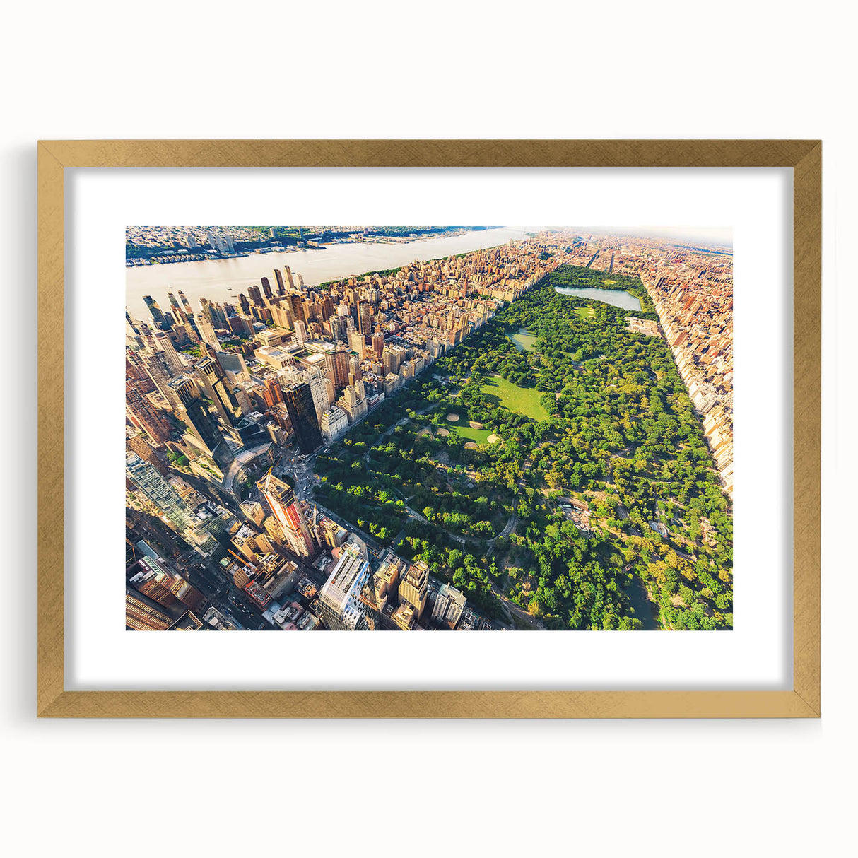 Extra large abstract art print of Central Park with textured details in muted greens and browns, framed in gold.