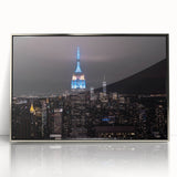 Mid-century modernist art depicting the Empire State Building in silver and gray tones on a framed acrylic print.