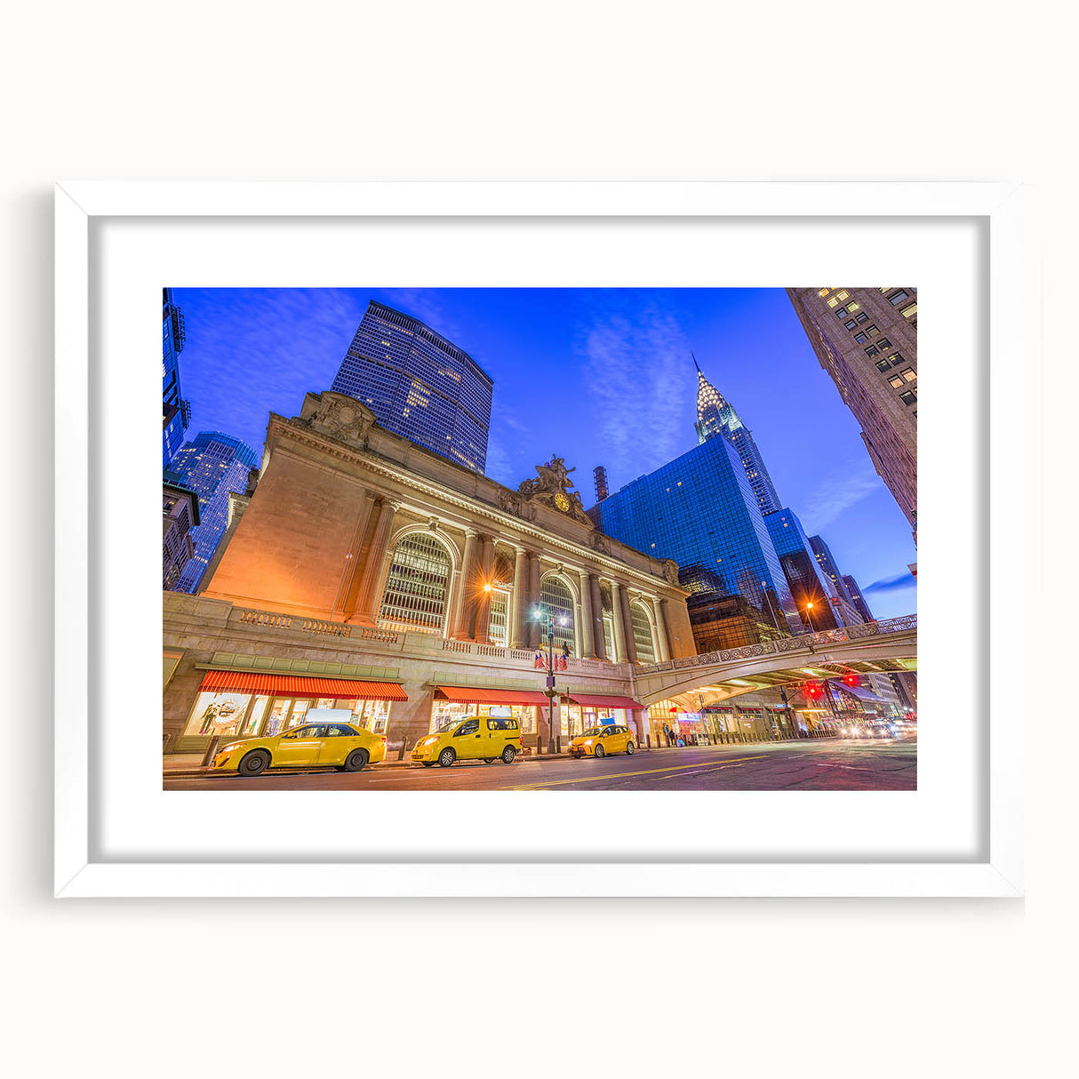 Abstract art print of NYC's Grand Central in muted gray and blue tones, framed in white, suitable for dining room decor.