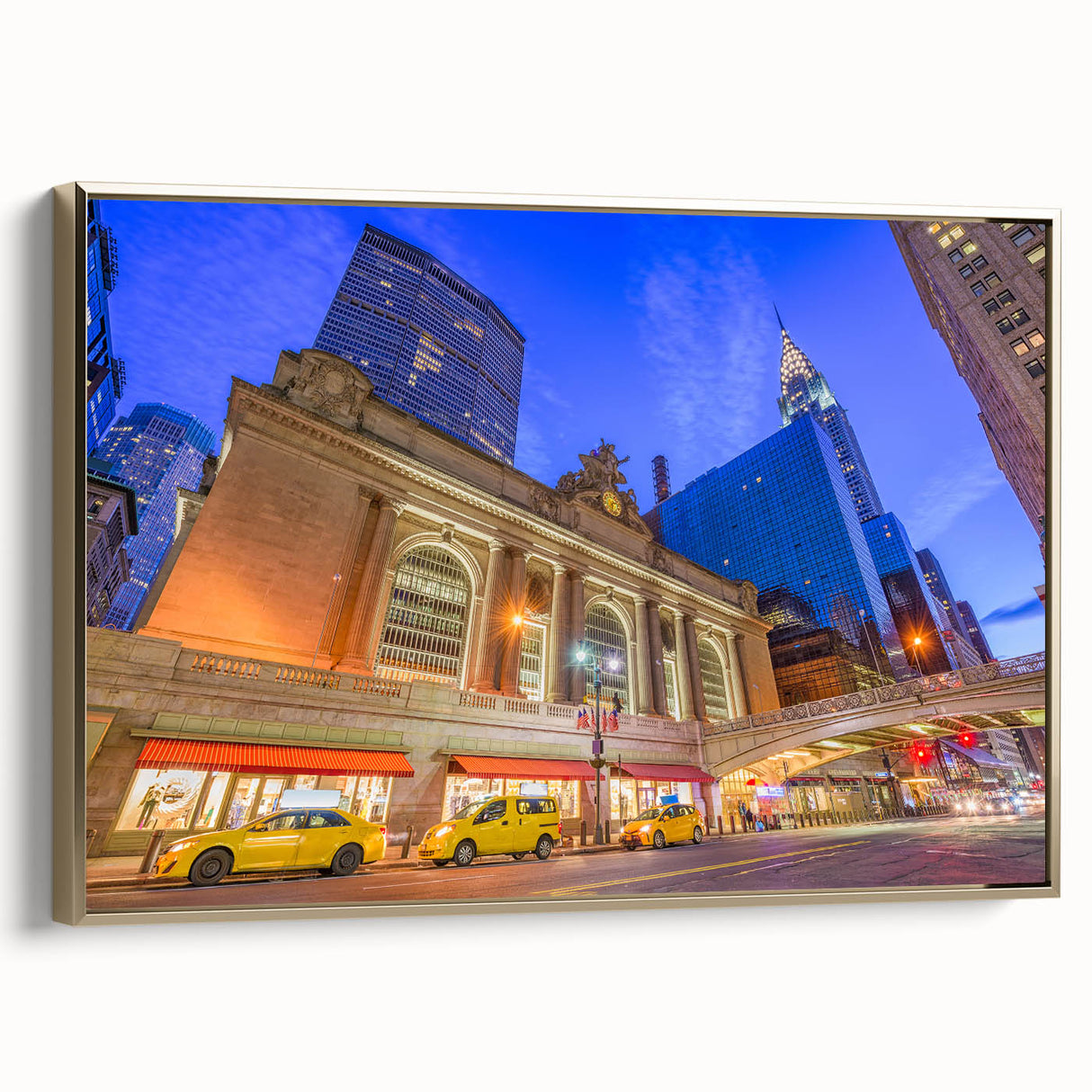 Framed canvas wall art featuring a vintage poster of Grand Central with a landscape in black and gold tones.