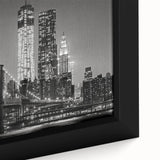Extra large framed canvas of a textured Manhattan skyline in black with colorful accents, suitable for living room decor.
