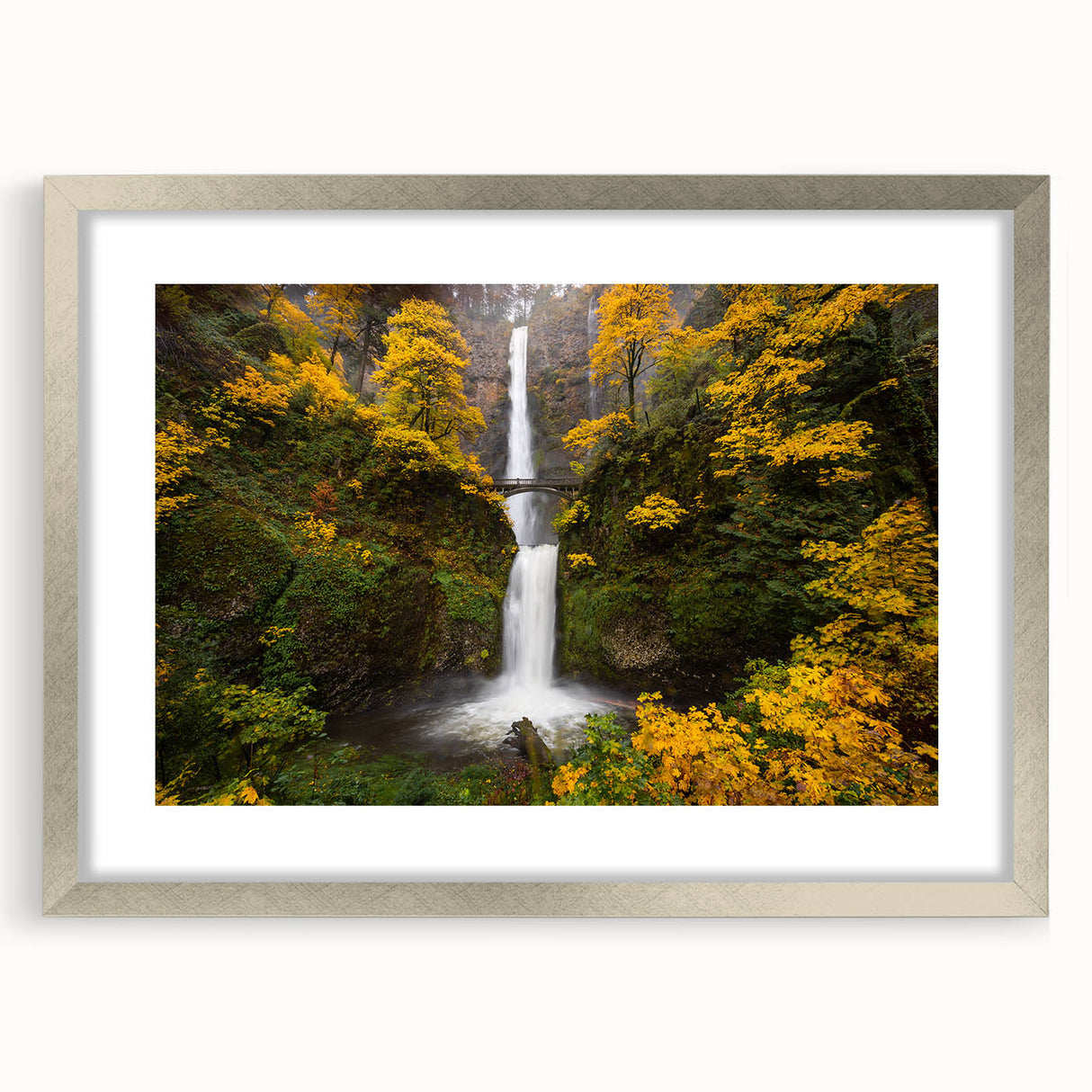 Textured art print of Multnomah Falls in Oregon, featuring vivid green and blue tones on a framed silver mat.
