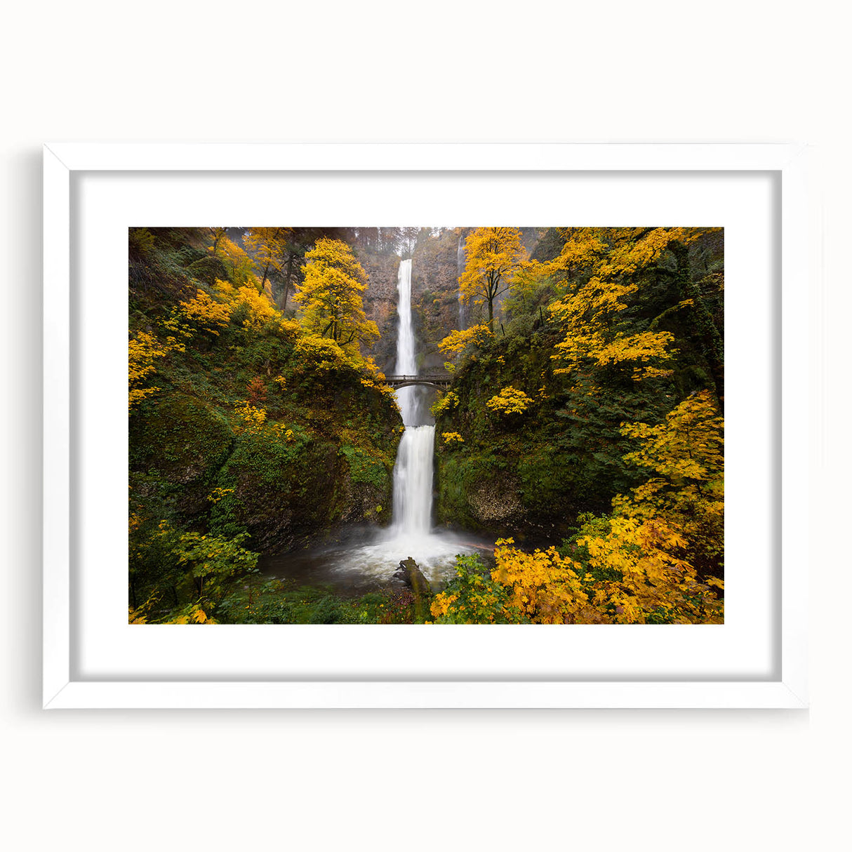Abstract art print of Multnomah Falls in muted green and blue tones on a framed white mat, ideal for dining room decor.