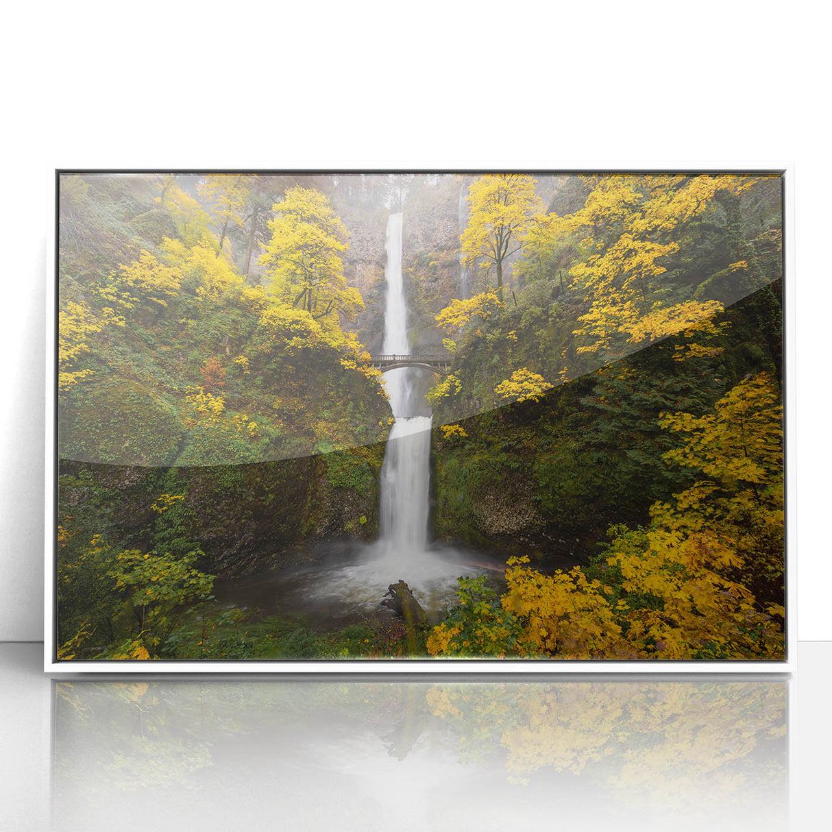 Art deco poster of Multnomah Falls in Oregon, using muted green and blue tones on white framed acrylic.
