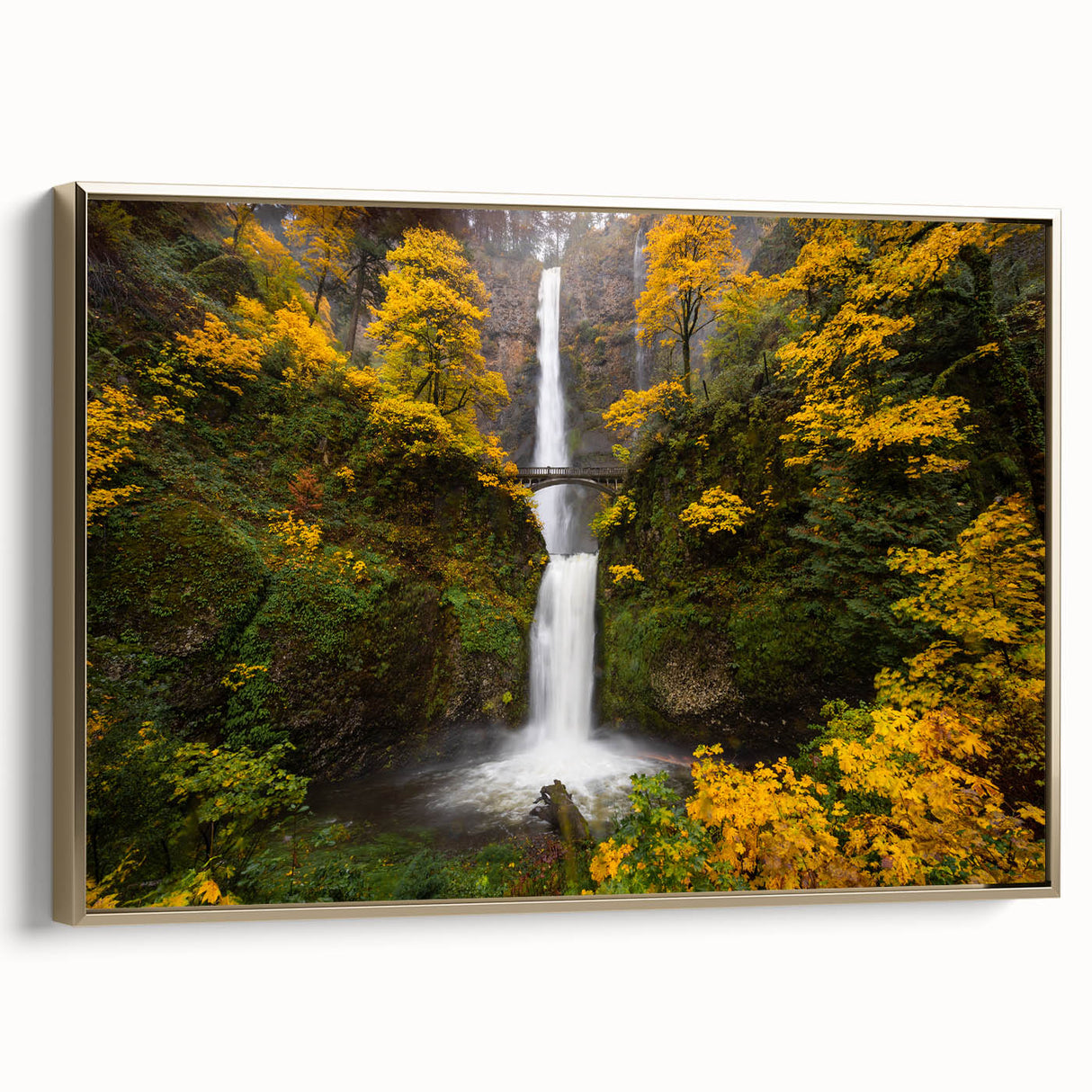 Framed canvas depicting Multnomah Falls in Oregon with lush greenery, ideal for bedroom wall art.