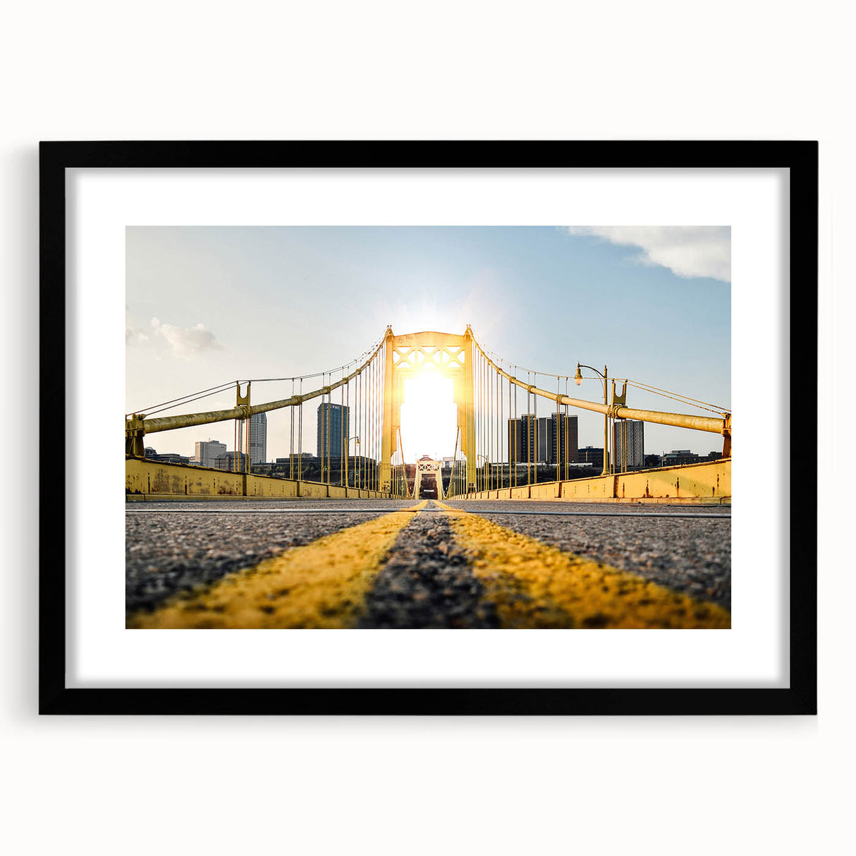 Colorful abstract art print depicting a textured Pittsburgh skyline, in a large black frame, suited for living room decor.