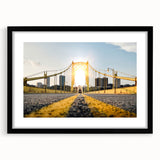 Colorful abstract art print depicting a textured Pittsburgh skyline, in a large black frame, suited for living room decor.