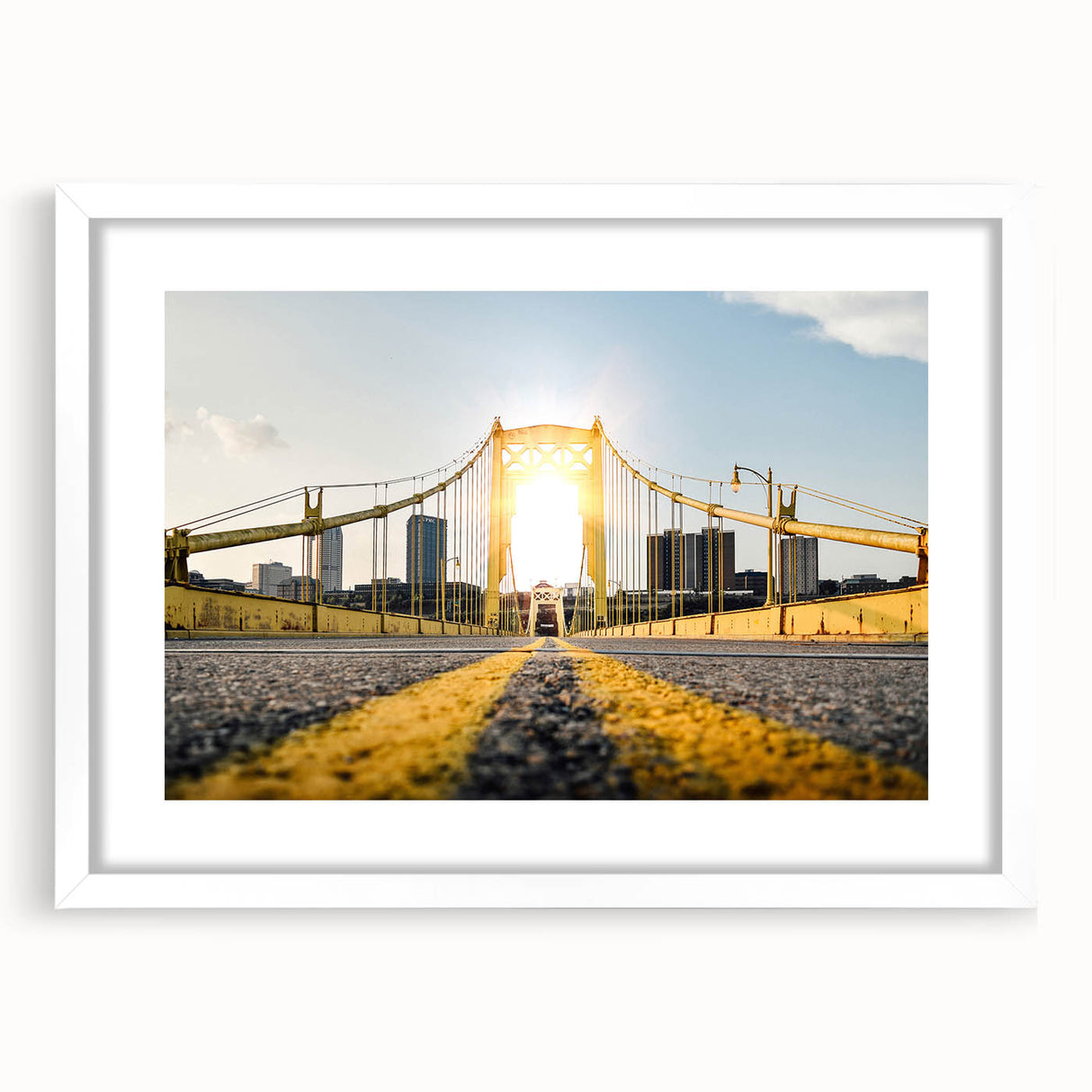 Abstract art print of Pittsburgh skyline in muted gray and blue tones, framed in white.