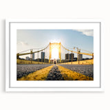 Abstract art print of Pittsburgh skyline in muted gray and blue tones, framed in white.