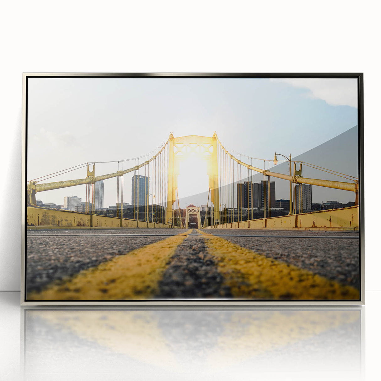 Mid-century modernist art of Pittsburgh skyline in muted gray and blue tones on a silver-framed acrylic print.