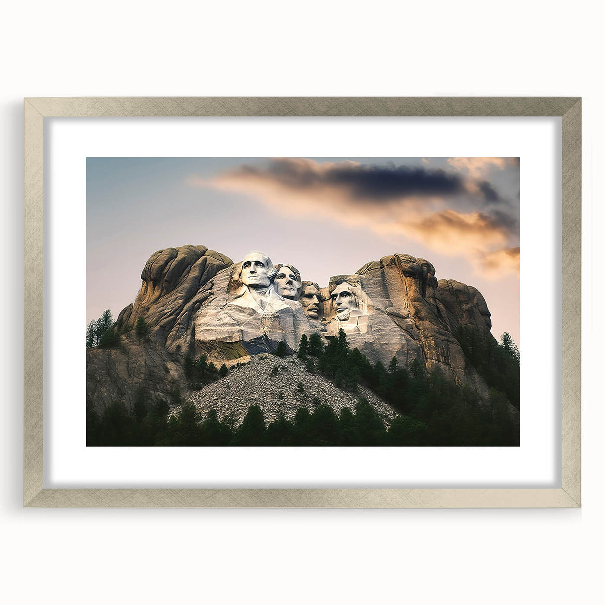 Textured art print of Mt. Rushmore in muted earth tones on a framed silver mat, suitable for bedroom decor.