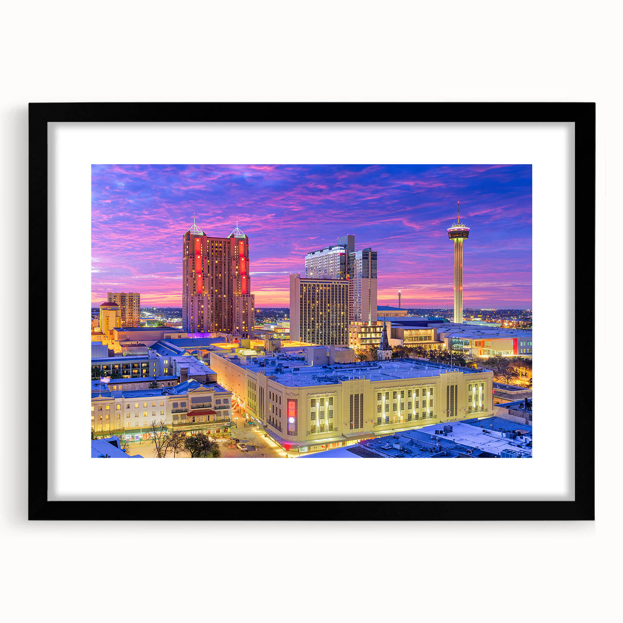 Extra large abstract art print of San Antonio skyline in vibrant colors on textured canvas, framed in black.