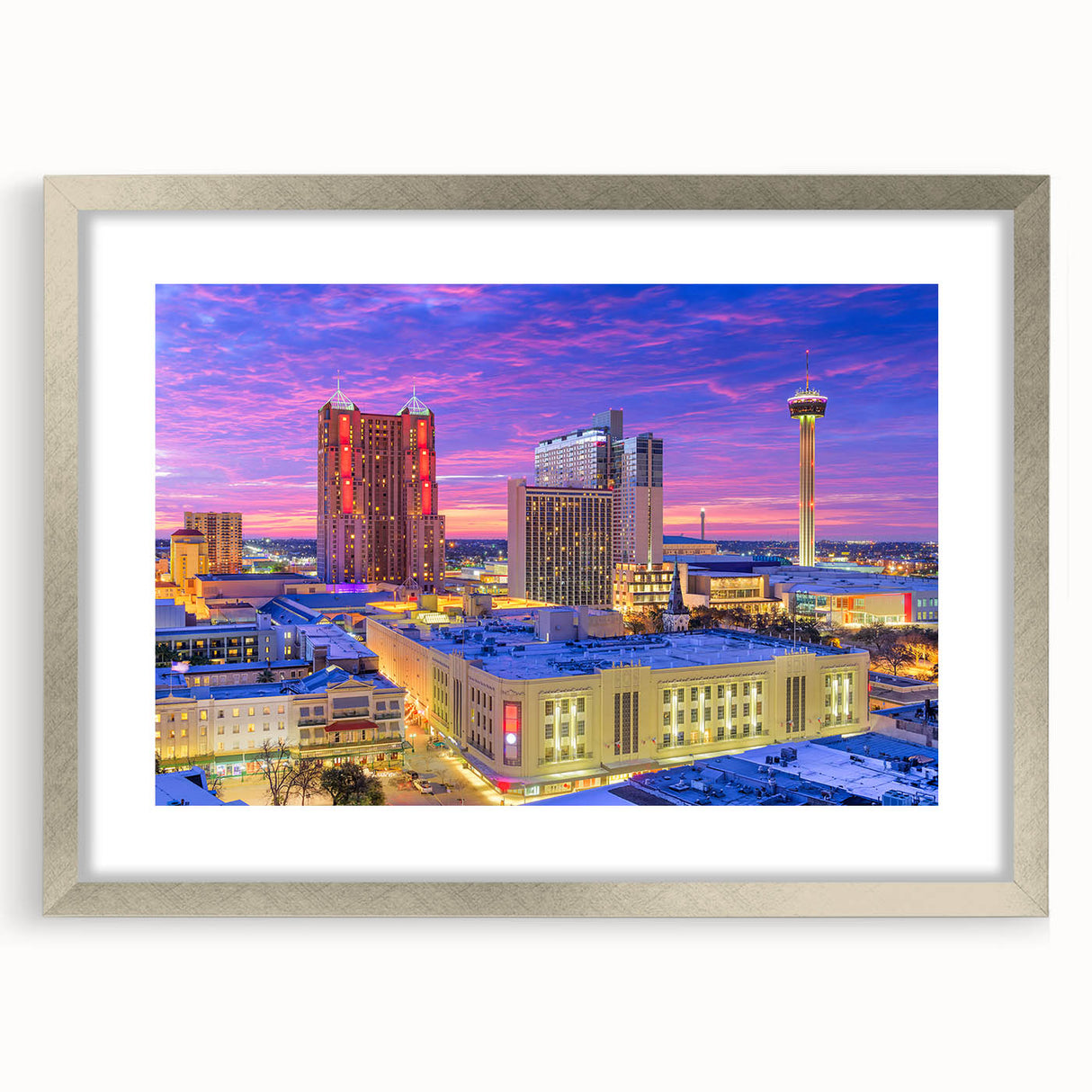 Textured abstract art print of San Antonio skyline in muted earth tones on a framed silver mat.