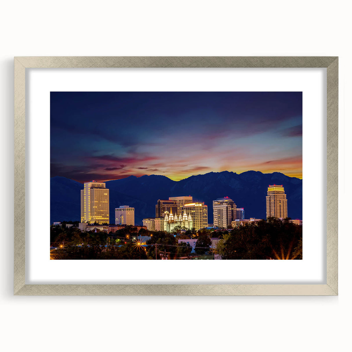 Textured abstract art print of Salt Lake City in muted earth tones, framed in silver, suitable for bedroom decor.