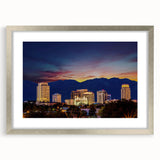 Textured abstract art print of Salt Lake City in muted earth tones, framed in silver, suitable for bedroom decor.