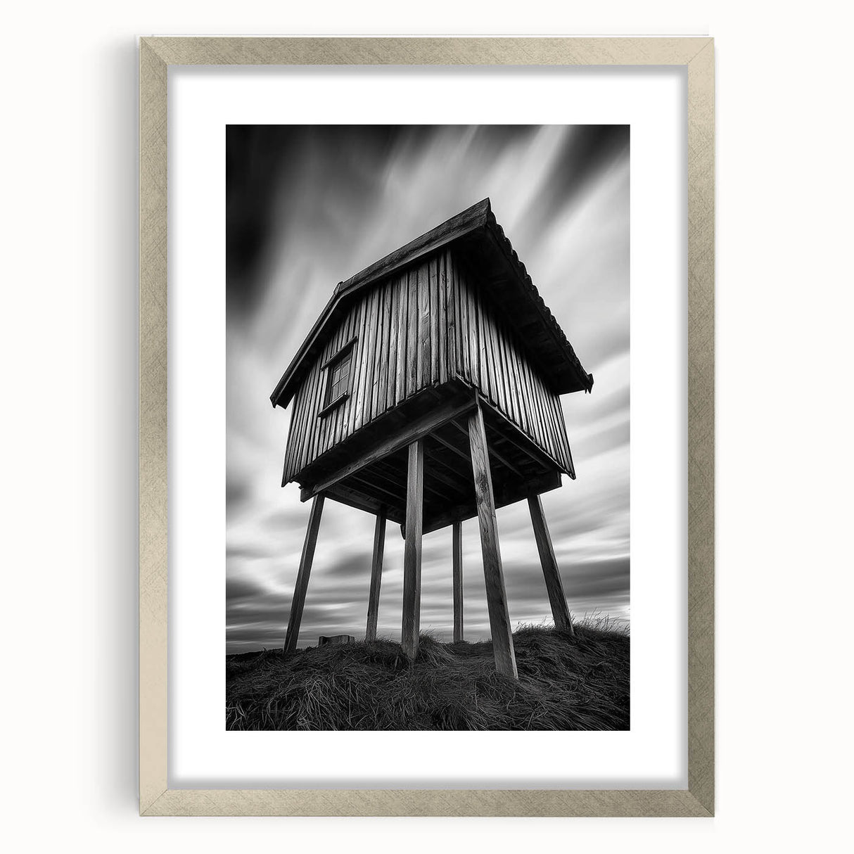 Textured abstract art print in muted gray and silver tones, framed in silver, ideal for modern bedroom ambiance.
