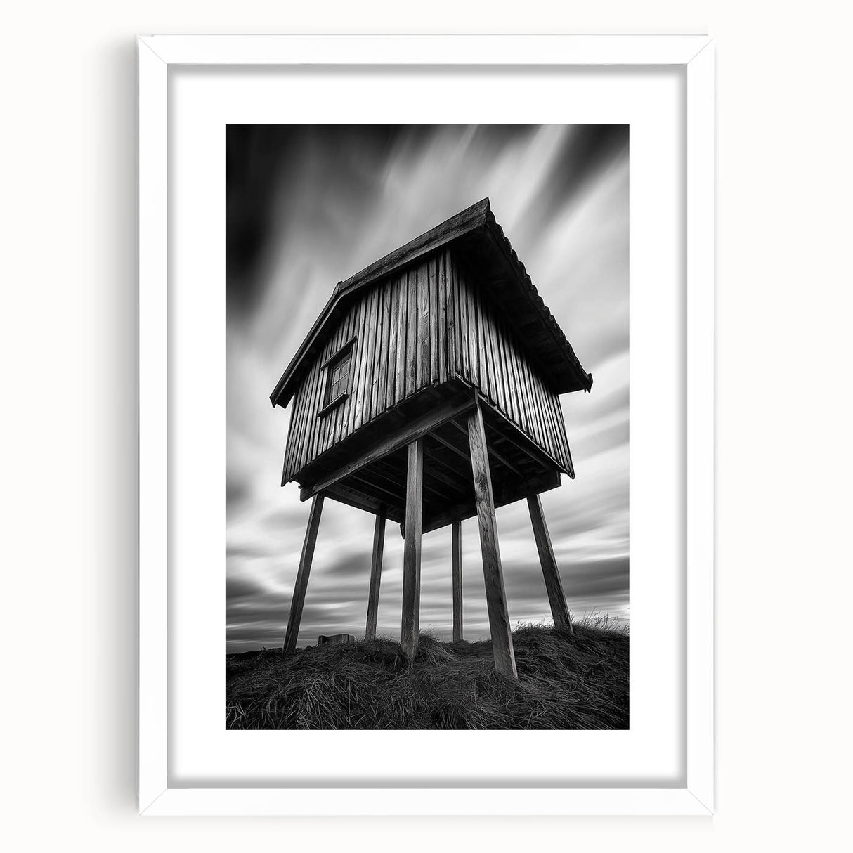 Abstract art print featuring swirling blue and grey tones on a white framed canvas.