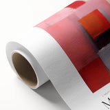 Art deco poster featuring geometric shapes in bold red and blue on rolled canvas.
