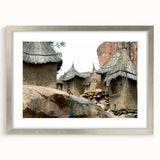 Abstract art print of African scenery in muted earth tones on a framed silver mat, ideal for dining room decor.
