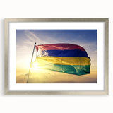 Abstract art print of an African scenery in muted earth tones on a framed silver mat.