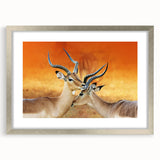 Abstract art print of African scenery in earthy tones on a framed canvas, suitable for dining room decor.