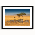 Extra large abstract art print of a colorful Tanzanian scenery on a textured canvas, framed in black.