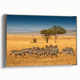 Framed canvas of a vintage-style landscape art painting depicting a Tanzanian scenery in colorful tones.