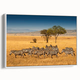 Vintage poster art of a Tanzanian landscape on framed canvas, featuring vibrant colors ideal for living room decor.