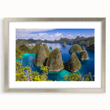 Textured abstract art print depicting a serene Indonesian landscape in muted earth tones, framed in silver.