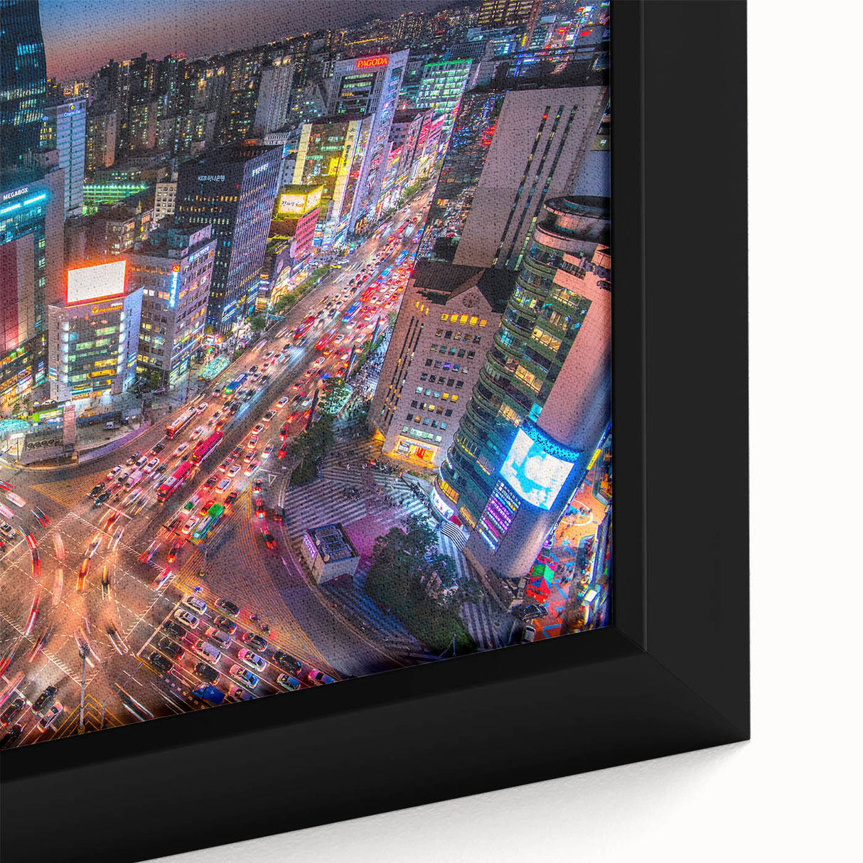 Close-up of a textured black wall art depicting Seoul's skyline with vibrant, colorful accents on a large framed canvas.