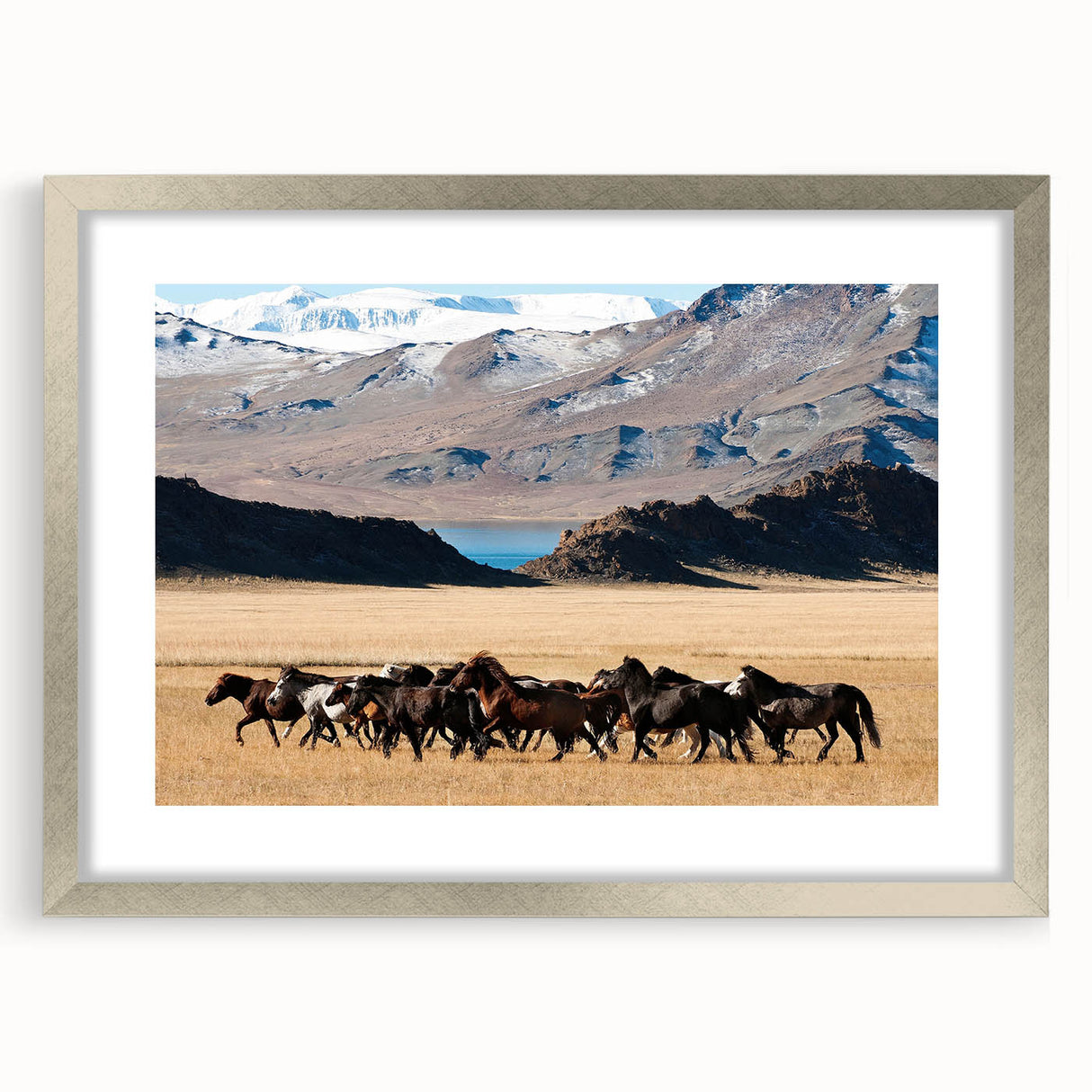 Textured abstract art print depicting a Mongolian landscape in muted earth tones, framed in silver, suitable for bedroom art.