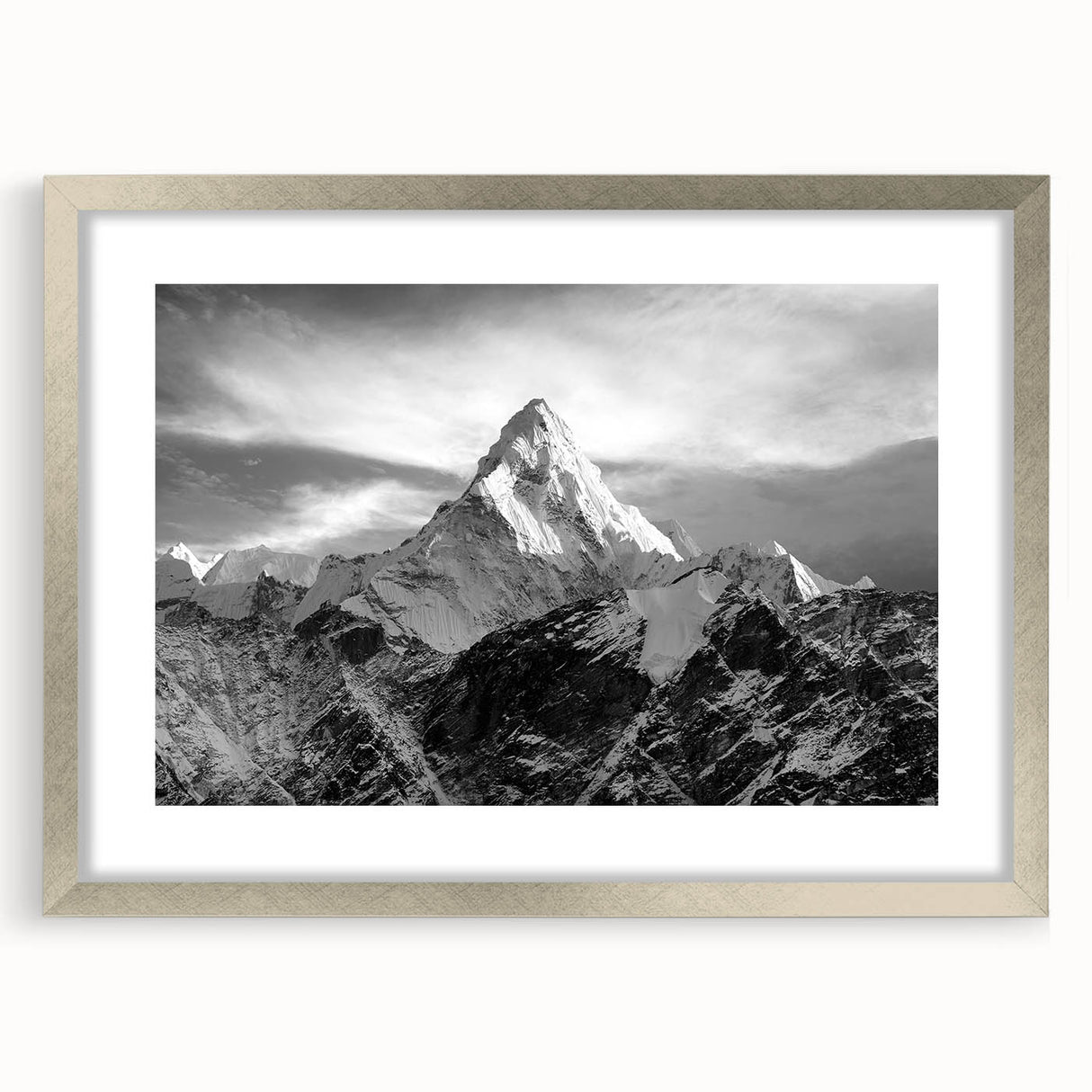 Textured art depicting abstract Mount Everest in muted earth tones on a framed silver mat, suitable for bedroom decor.