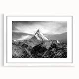 Abstract art print of Mount Everest in muted blue and gray tones on a framed white mat.