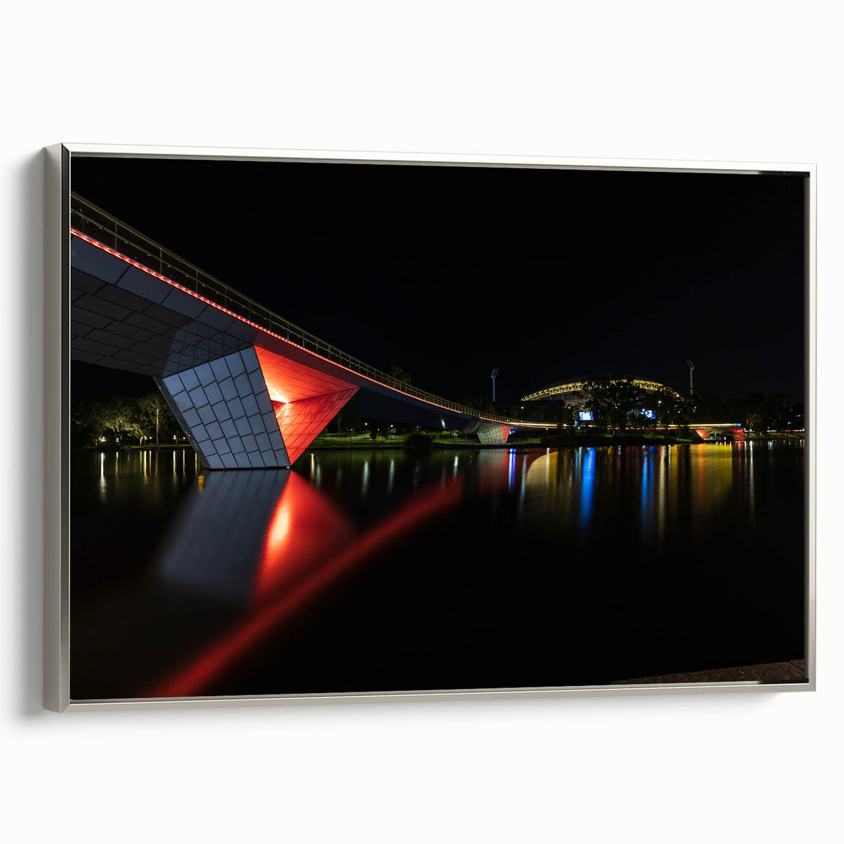 Vintage poster art of Adelaide scenery in vibrant colors on a silver-framed canvas, ideal for living room decor.