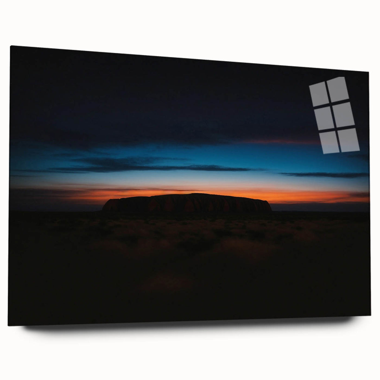 Large abstract depiction of Ayers Rock in Australia on an acrylic glass, featuring earthy red and orange tones.