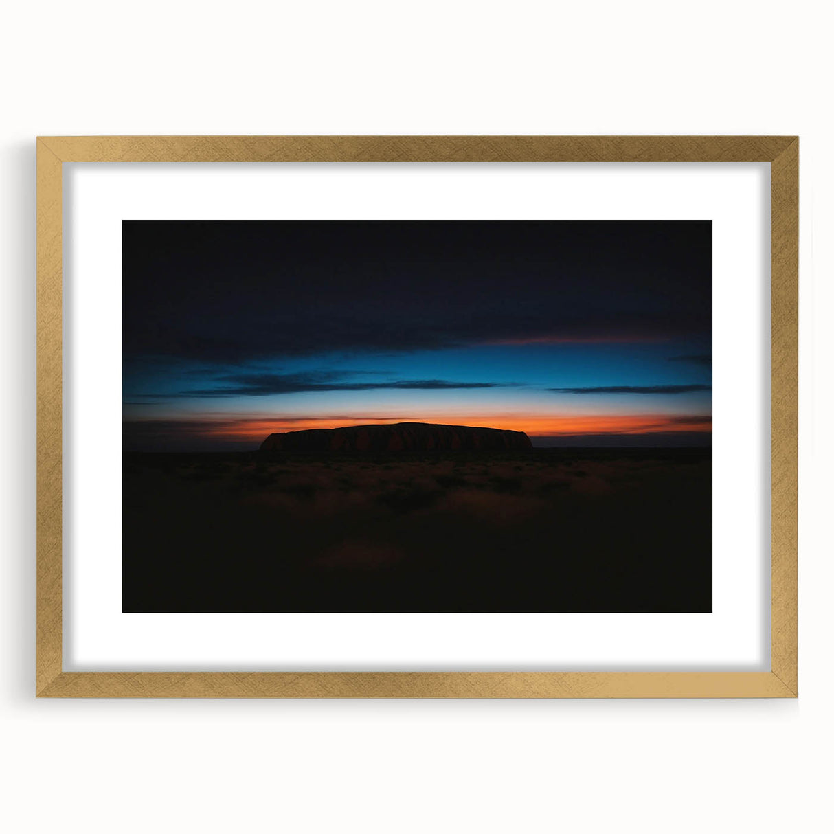 Textured art depicting Ayers Rock in muted earth tones on a framed canvas, ideal for bedroom art.