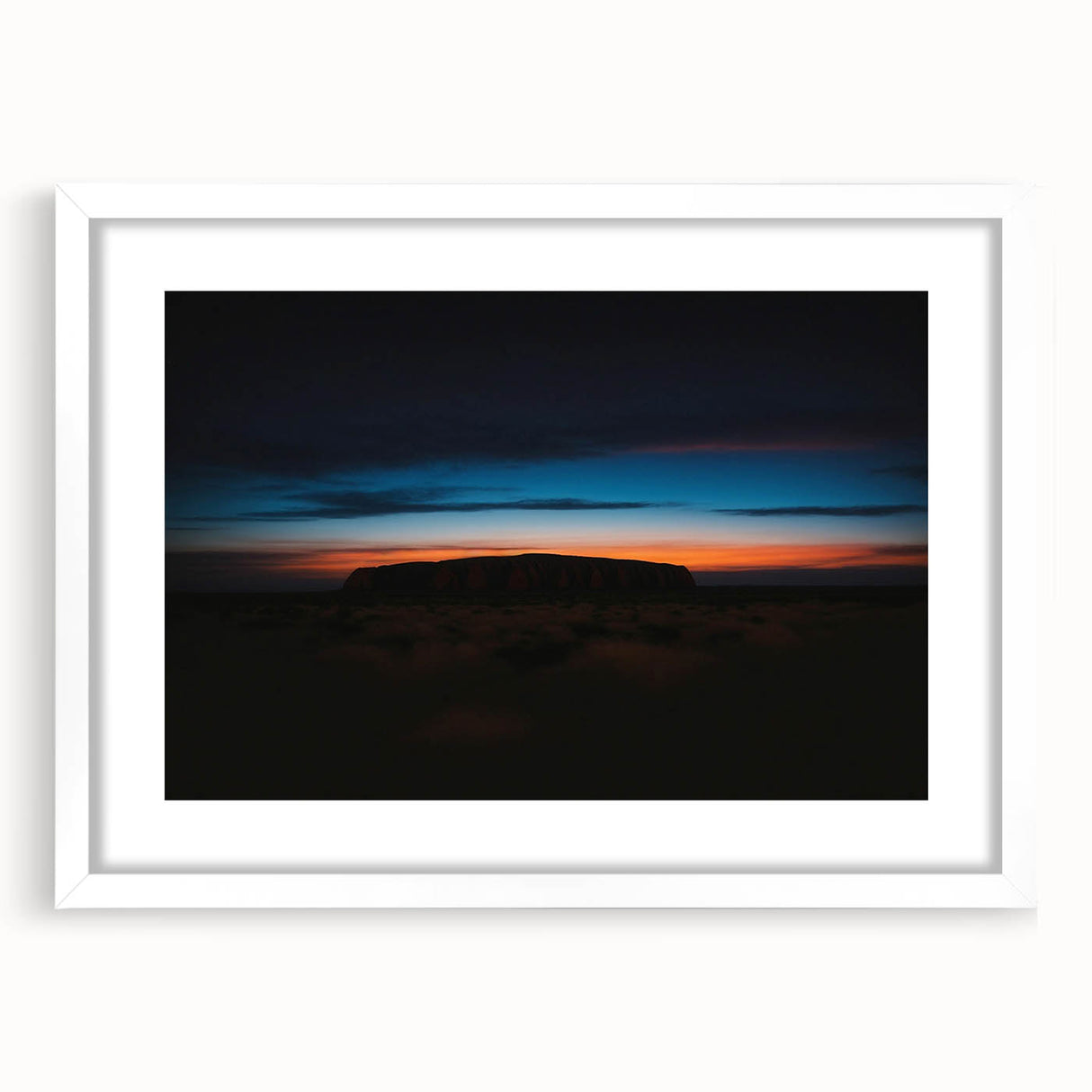 Extra large textured abstract print of Ayers Rock in muted orange and brown shades on a white framed canvas.