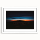 Extra large textured abstract print of Ayers Rock in muted orange and brown shades on a white framed canvas.