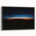 Black and white framed canvas of Ayers Rock landscape, ideal for bedroom decor.