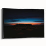 Black and white framed canvas of Ayers Rock landscape, ideal for bedroom decor.