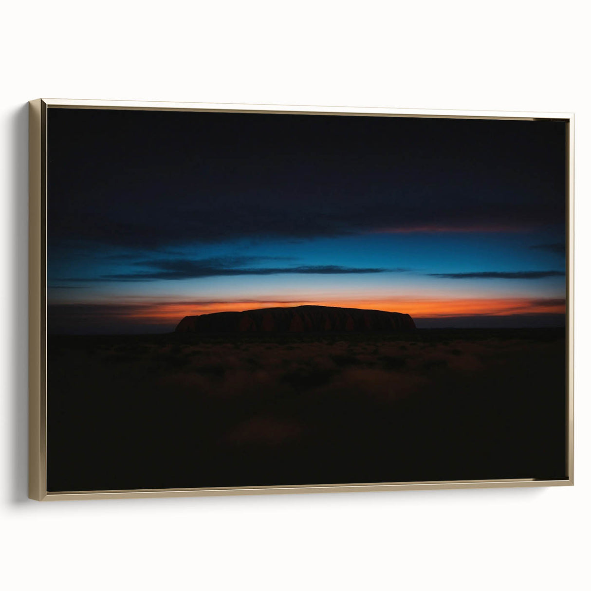 Framed canvas depicting Ayers Rock in Australia with a vintage poster style, featuring a black and colorful art palette.